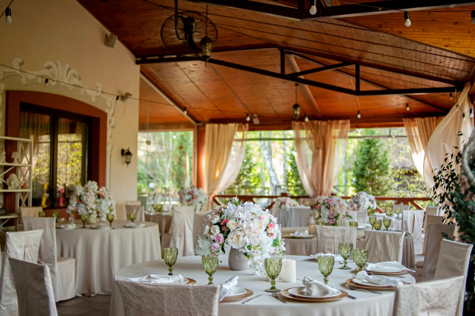 The Villa Vita terrace with banquet tables among the greenery